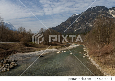 Clear river bending through alpine valley in late winter, Bavaria, Germany Clear river bending through alpine valley in late winter, Bavaria, Germany 138004881