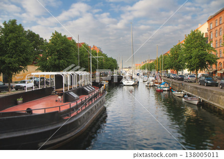 Canal with boats and historic buildings in Copenhagen with tilt-shift effect 138005011