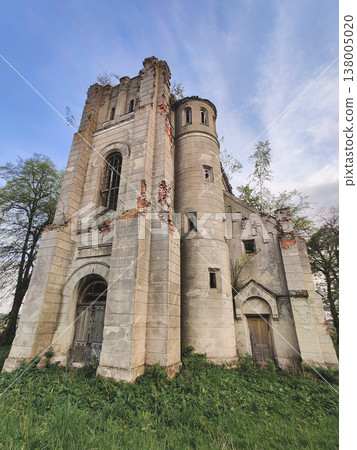 Abandoned Holy Trinity Church in Rodatychi resembling a medieval castle with tall stone towers 138005020