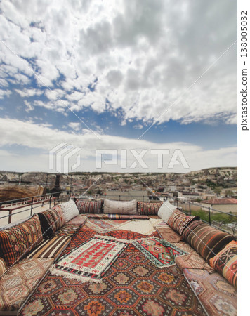 Traditional Turkish rooftop terrace with kilim carpets and cushions in Cappadocia Traditional Turkish rooftop terrace with kilim carpets and cushions in Cappadocia 138005032
