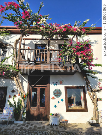 Traditional white house with a dark wooden balcony and bougainvillea in Kalkan Turkey Traditional white house with a dark wooden balcony and bougainvillea in Kalkan Turkey 138005069