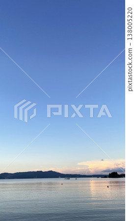 The Okinawan sea at dusk, a tranquil tropical seascape at twilight - Nakama Beach The Okinawan sea at dusk, a tranquil tropical seascape at twilight - Nakama Beach 138005220