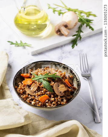Buckwheat porridge with mushrooms, carrots and lettuce leaves, healthy nutrition Buckwheat porridge with mushrooms, carrots and lettuce leaves, healthy nutrition 138005273