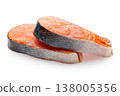 Two fresh raw salmon steaks lying on each other isolated on white background, sharpness across the entire object 138005356