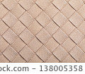 The beige texture of intertwined suede leather, forming a square abstract shape, authentic photograph, not AI-generated 138005358