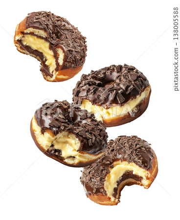 Chocolate glazed cream filled donuts with visible bite marks, isolated on white background. Concept of sweet dessert pattern Chocolate glazed cream filled donuts with visible bite marks, isolated on white background. Concept of sweet dessert pattern 138005588