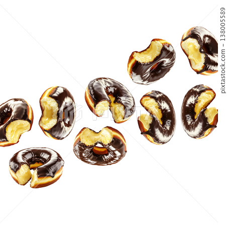 Chocolate glazed cream filled donuts with visible bite marks, isolated on white background. Concept of sweet dessert pattern Chocolate glazed cream filled donuts with visible bite marks, isolated on white background. Concept of sweet dessert pattern 138005589