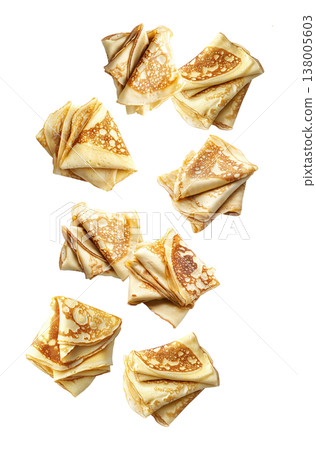Multiple folded golden crepes arranged in a scattered seamless pattern on white background, representing a delicious food concept 138005603