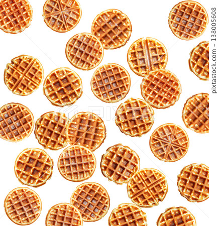 Multiple round caramel stroopwafels arranged in a scattered pattern from above, on a white background. Concept of sweet snacks Multiple round caramel stroopwafels arranged in a scattered pattern from above, on a white background. Concept of sweet snacks 138005608