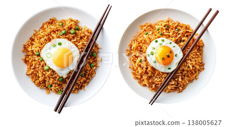 Spicy fried rice Nasi Goreng garnished with fresh green onions and topped with fried egg in bowl, isolated on white Spicy fried rice Nasi Goreng garnished with fresh green onions and topped with fried egg in bowl, isolated on white 138005627