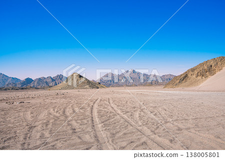 Desert Landscape with Tire Tracks in Hurghada Egypt Desert Landscape with Tire Tracks in Hurghada Egypt 138005801