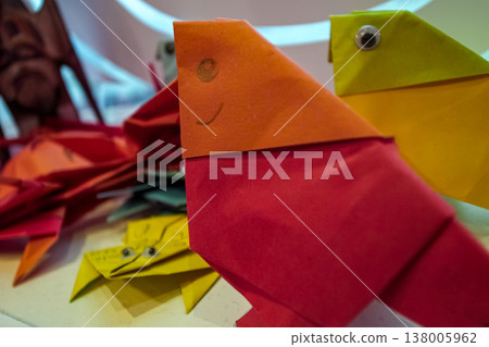 Close-up of paper folding in bird shape. Kids' diy, artcraft. Creative work. 138005962