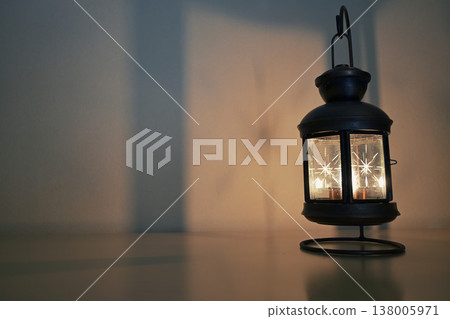Patterns projected onto a wall illuminated by a lantern Patterns projected onto a wall illuminated by a lantern 138005971