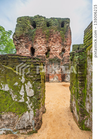 Ancient Royal Palace Ruins in Polonnaruwa, Sri Lanka. Ancient Brick Ruin Covered in Green Moss Under Overcast Sky, Historical Structure and Textured Walls Ancient Royal Palace Ruins in Polonnaruwa, Sri Lanka. Ancient Brick Ruin Covered in Green Moss Under Overcast Sky, Historical Structure and Textured Walls 138006215