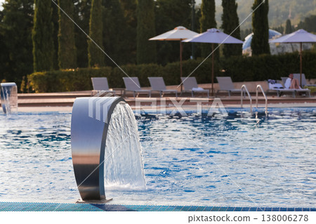 Relaxing Evening By Water. Luxury Resort Ambiance With Flowing Fountain And Peaceful Surroundings Relaxing Evening By Water. Luxury Resort Ambiance With Flowing Fountain And Peaceful Surroundings 138006278