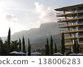 Serene Mountain Sunrise Lighting Tranquil Resort With Cypress Silhouettes And Bright Umbrellas 138006283