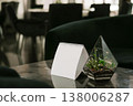 Stylish Table Setup With Calming Ambiance. Relaxing Lounge Scene With Inviting Light And Decor 138006287