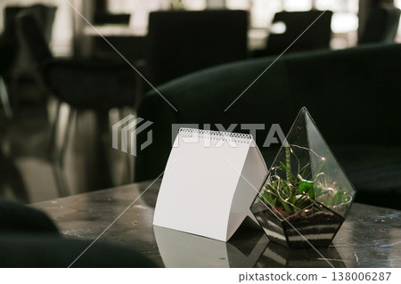 Stylish Table Setup With Calming Ambiance. Relaxing Lounge Scene With Inviting Light And Decor Stylish Table Setup With Calming Ambiance. Relaxing Lounge Scene With Inviting Light And Decor 138006287