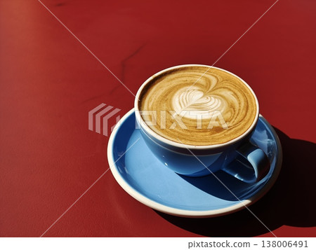 Latte Art Blue Cup Landscape on Red Table Latte Art Blue Cup Landscape on Red Table 138006491