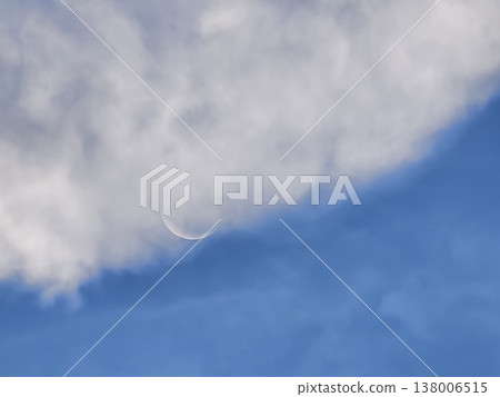 Waxing Crescent Moon Emerging from Daytime Clouds Waxing Crescent Moon Emerging from Daytime Clouds 138006515