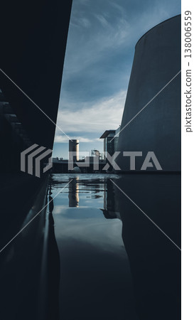 Modern urban architecture with concrete forms and water reflection in minimal space, Contemporary building with geometric lines mirrored in calm pool creating abstract city scene, Dib Museum Bangkok 138006559