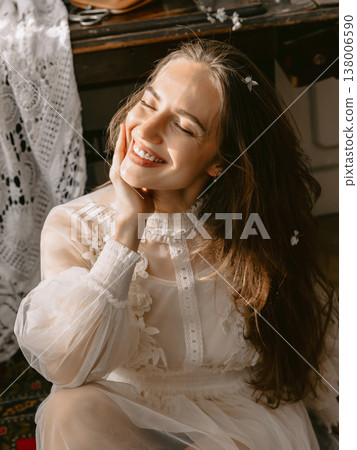 Dreamy portrait of young woman in lace dress, soft smile and romantic vintage mood. Dreamy portrait of young woman in lace dress, soft smile and romantic vintage mood. 138006590