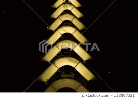 Building exterior at night. Glowing light in the border of building. Lighting decoration. Building exterior at night. Glowing light in the border of building. Lighting decoration. 138007321