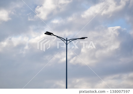 Close-up of the streetlight with blue sky background. City light in the street. Cityscape and downtown scene. 138007597