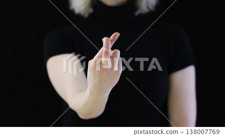 A beautiful crossed finger sign against the evil eye, from conspiracies against bad people 138007769