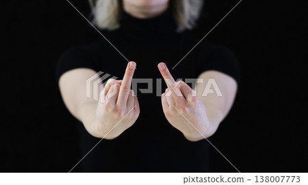 A woman's hand shows the middle finger, which signifies displeasure. A woman's hand shows the middle finger, which signifies displeasure. 138007773