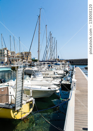 A yacht harbor in Bastia port, nestled beside a historic cityscape, on the French island of Corsica in the Mediterranean Sea. A yacht harbor in Bastia port, nestled beside a historic cityscape, on the French island of Corsica in the Mediterranean Sea. 138008120