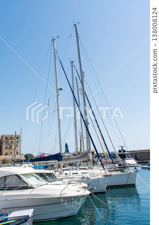 A yacht harbor in Bastia port, nestled beside a historic cityscape, on the French island of Corsica in the Mediterranean Sea. A yacht harbor in Bastia port, nestled beside a historic cityscape, on the French island of Corsica in the Mediterranean Sea. 138008124