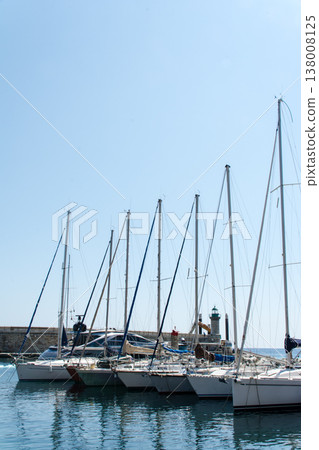 A yacht harbor in Bastia port, nestled beside a historic cityscape, on the French island of Corsica in the Mediterranean Sea. 138008125