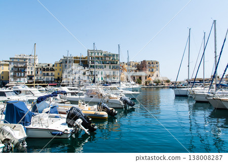 A yacht harbor in Bastia port, nestled beside a historic cityscape, on the French island of Corsica in the Mediterranean Sea. A yacht harbor in Bastia port, nestled beside a historic cityscape, on the French island of Corsica in the Mediterranean Sea. 138008287