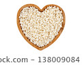 Raw dried white corn, used in the preparation of canjica, a Brazilian dessert made with corn, in a wooden bowl, isolated on a white background. 138009084