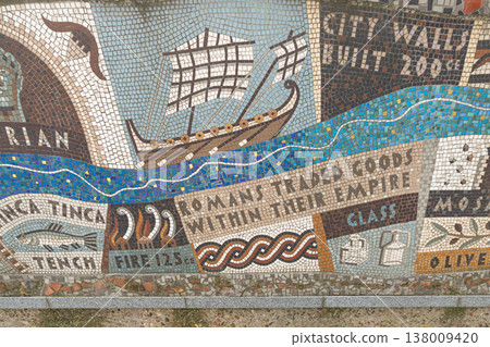 A blue ribbon of tile flows through the mosaic, tracing the River Thames as an ancient artery of trade. An imperial cargo ship sails past rising city walls, illustrating a 2,000-year history of A blue ribbon of tile flows through the mosaic, tracing the River Thames as an ancient artery of trade. An imperial cargo ship sails past rising city walls, illustrating a 2,000-year history of 138009420