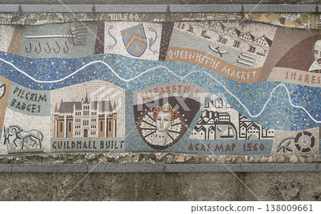 A shimmering ribbon of blue tesserae meanders across the wall, a living artery that symbolizes the Thames as it pulses through centuries of human endeavor. This mosaic river flows through a vibrant A shimmering ribbon of blue tesserae meanders across the wall, a living artery that symbolizes the Thames as it pulses through centuries of human endeavor. This mosaic river flows through a vibrant 138009661