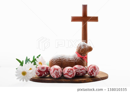 Easter lamb cake with decorated eggs and wooden cross Easter lamb cake with decorated eggs and wooden cross 138010335
