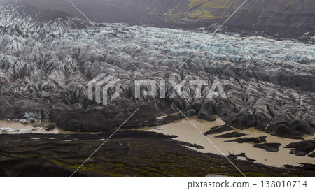 Aerial View of Glacier with Volcanic Ash and Meltwater in Iceland Aerial View of Glacier with Volcanic Ash and Meltwater in Iceland 138010714