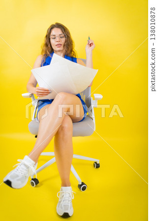 Woman analyzing documents planning creative business ideas Woman analyzing documents planning creative business ideas 138010878
