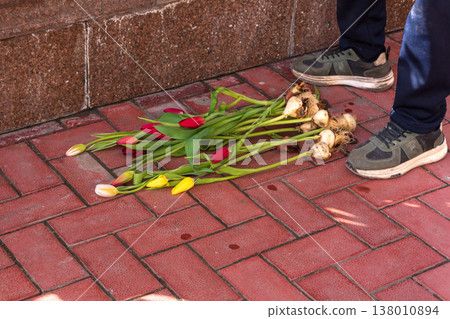 Rejected gift of spring flowers, end of romance and emotional heartbreak concept. Rejected gift of spring flowers, end of romance and emotional heartbreak concept. 138010894