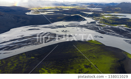 Aerial View of Iceland's Volcanic Terrain with Rivers and Rainbow Aerial View of Iceland's Volcanic Terrain with Rivers and Rainbow 138011029