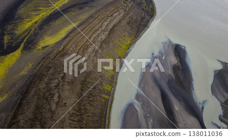 Aerial View of Volcanic Terrain and Glacial River in Iceland Aerial View of Volcanic Terrain and Glacial River in Iceland 138011036
