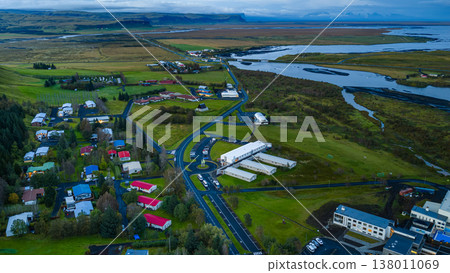 Aerial View of Icelandic Town with Green Fields and Winding Roads Aerial View of Icelandic Town with Green Fields and Winding Roads 138011069