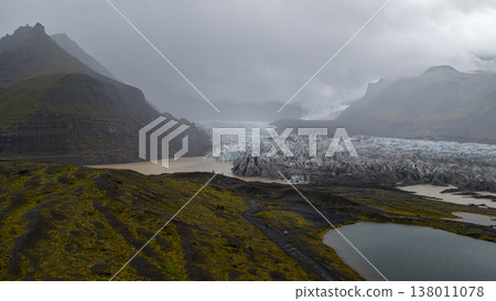 Aerial View of Icelandic Glacier with Lagoon and Volcanic Terrain Aerial View of Icelandic Glacier with Lagoon and Volcanic Terrain 138011078