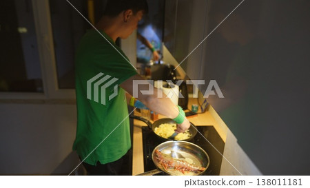 Serene domestic setting with individual preparing morning meal happily Serene domestic setting with individual preparing morning meal happily 138011181