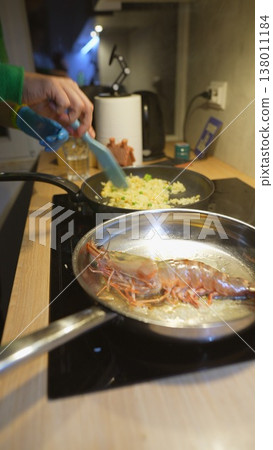 Detailed view of bacon sizzling in skillet under professional lighting Detailed view of bacon sizzling in skillet under professional lighting 138011184