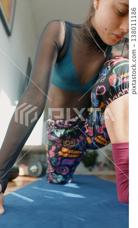 Sunlit interior highlights detailed torso posture in exercise 138011186