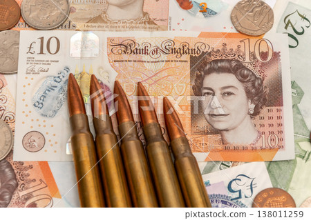 Ammunition on British money shows conflict and financial risks in England 138011259