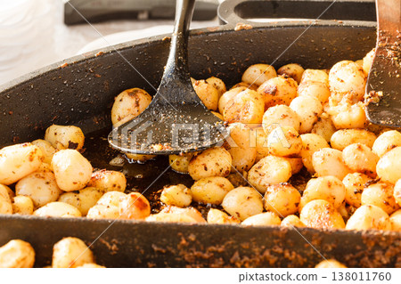 Backed young potatoes with spices in bowl Backed young potatoes with spices in bowl 138011760